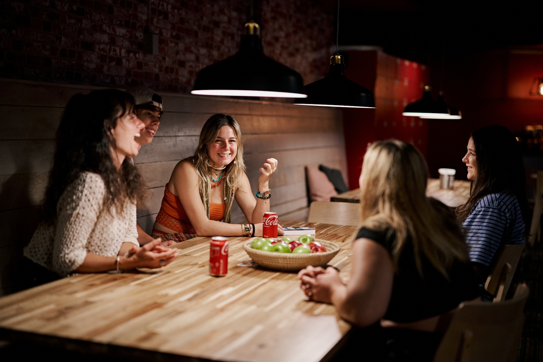 Urban Nomad guests relaxing and chatting in the communal lounge